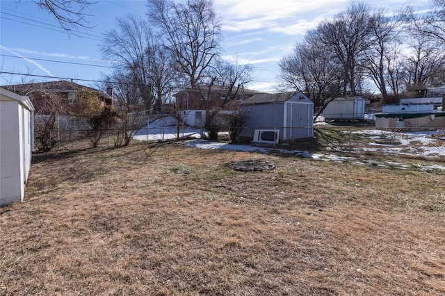 view of yard featuring a storage unit