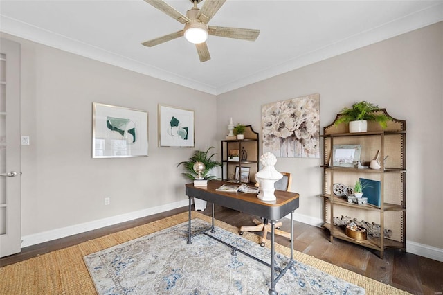 office area featuring dark wood-type flooring, ornamental molding, and ceiling fan