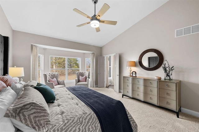 bedroom featuring ceiling fan, high vaulted ceiling, and light carpet