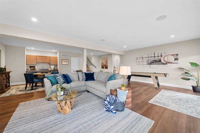 living room with light hardwood / wood-style flooring