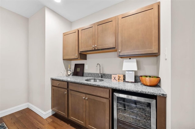 kitchen with sink, hardwood / wood-style floors, and wine cooler