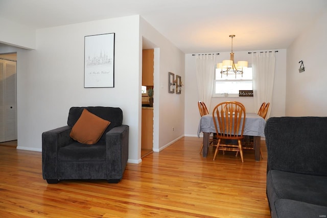 dining room featuring an inviting chandelier and light hardwood / wood-style floors