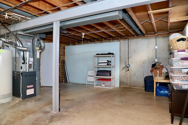 basement featuring heating unit and water heater