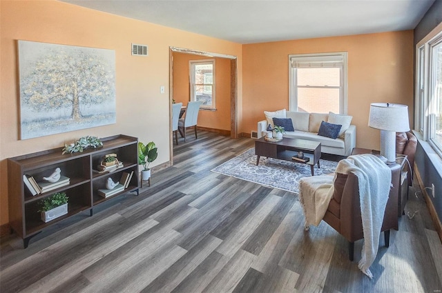 living room featuring dark wood-type flooring