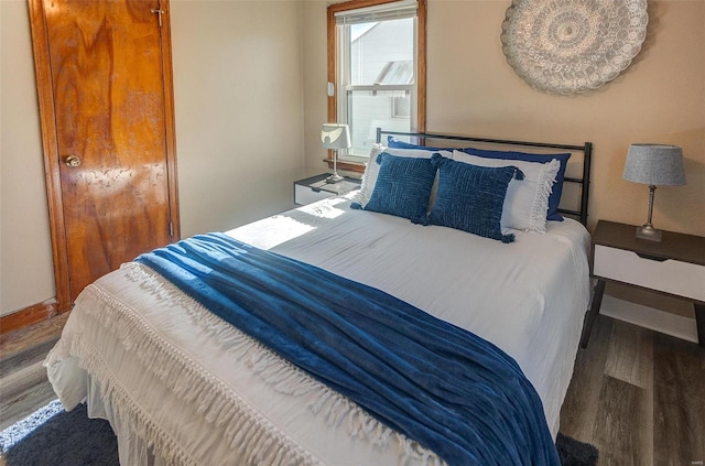 bedroom with hardwood / wood-style floors