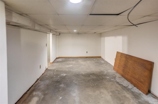 basement featuring a paneled ceiling