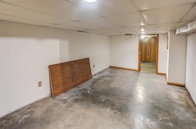 basement featuring a paneled ceiling