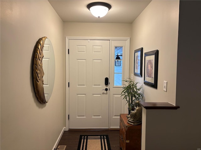 entryway with dark wood-type flooring