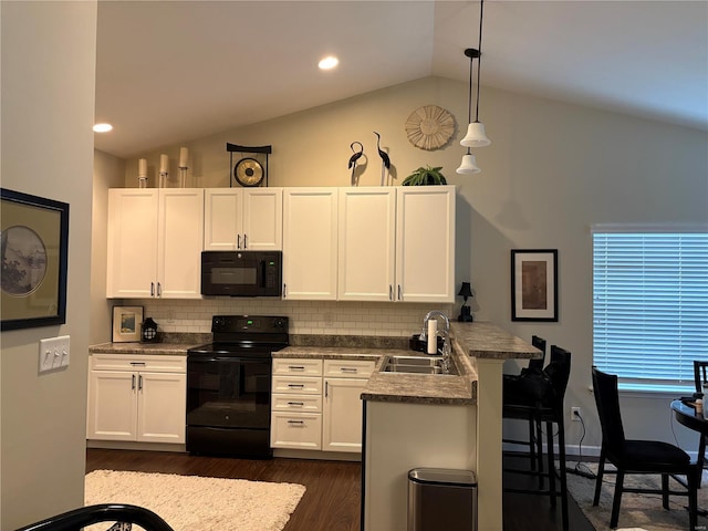 kitchen with sink, hanging light fixtures, black appliances, white cabinets, and kitchen peninsula