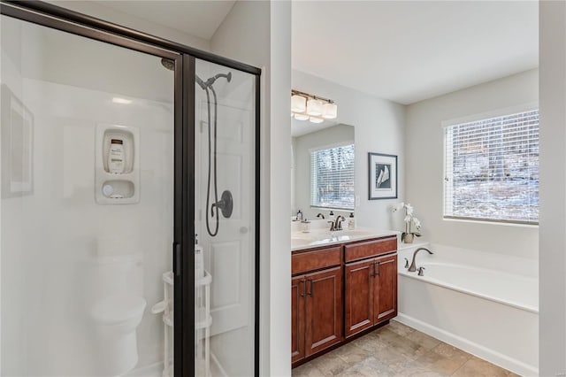 bathroom featuring vanity and plus walk in shower