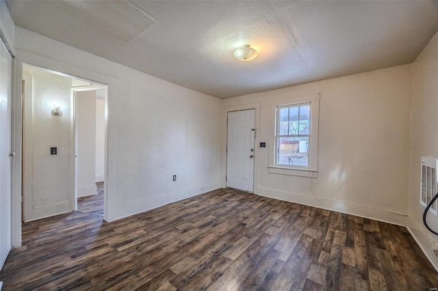 foyer entrance featuring dark hardwood / wood-style floors