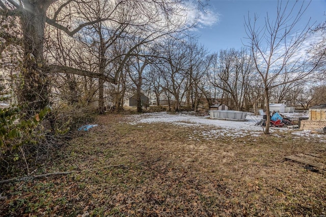 view of yard covered in snow