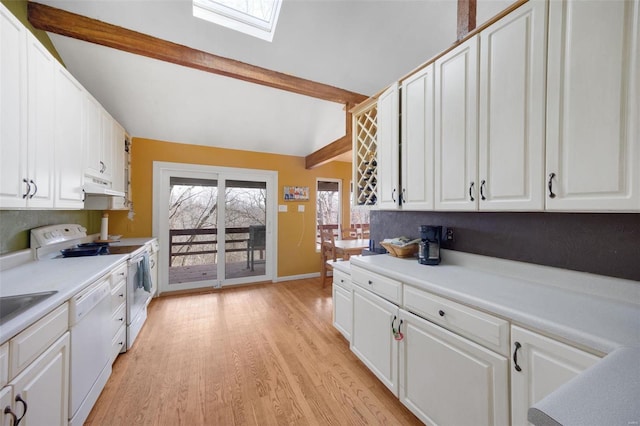 kitchen featuring light countertops, white dishwasher, and white cabinetry