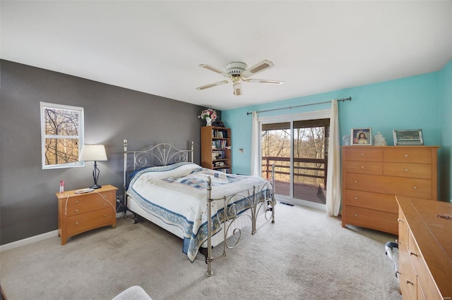 bedroom featuring light carpet, visible vents, baseboards, a ceiling fan, and access to outside