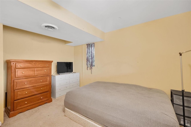 bedroom with visible vents and light colored carpet