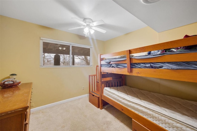 bedroom featuring light carpet, ceiling fan, and baseboards