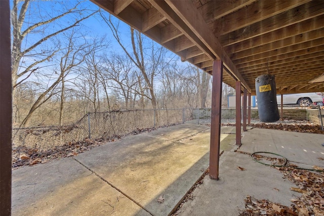 view of patio featuring fence