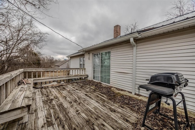 wooden deck featuring area for grilling