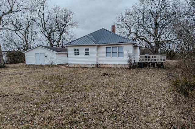 back of property featuring a deck