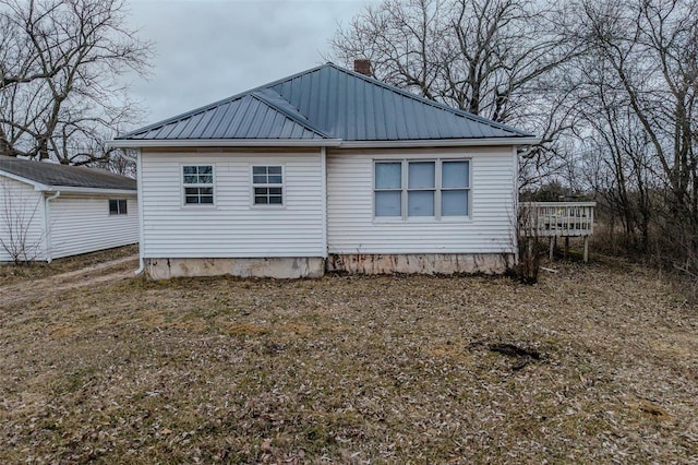 view of side of home with a deck