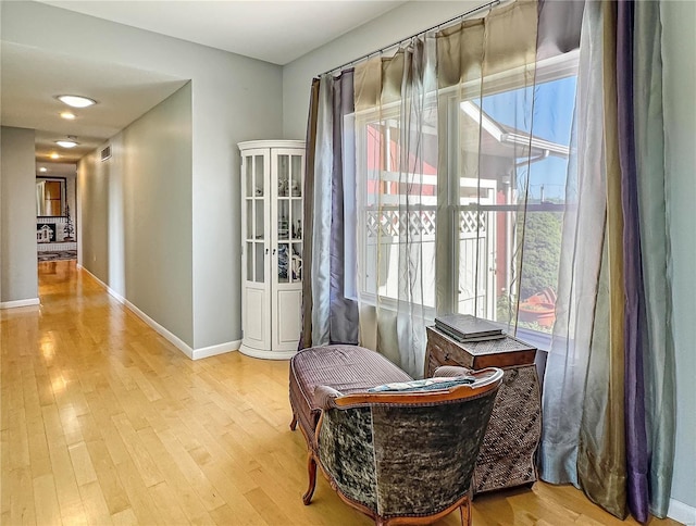 sitting room featuring light hardwood / wood-style floors