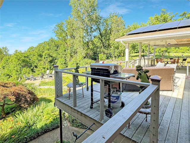 wooden terrace featuring outdoor lounge area