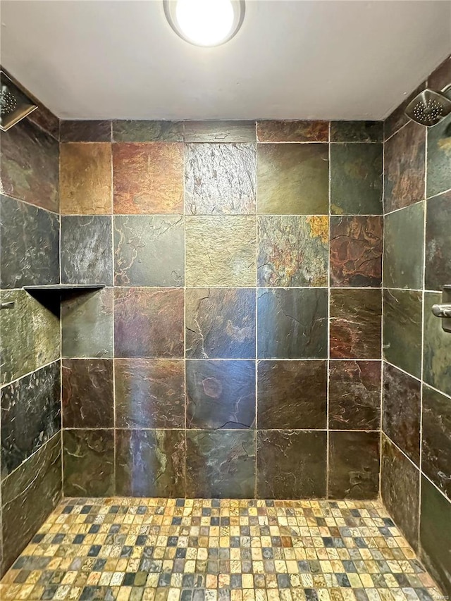 bathroom with a tile shower