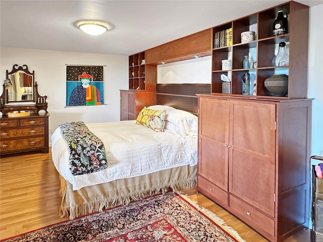 bedroom with light hardwood / wood-style floors