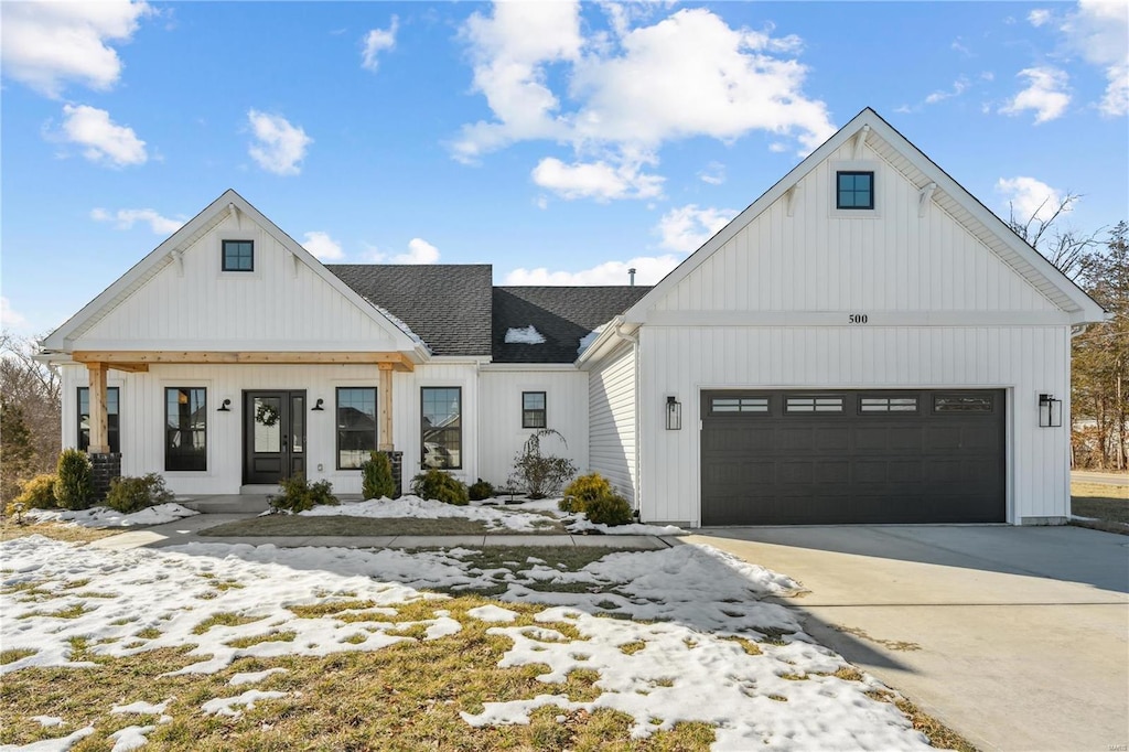 modern farmhouse style home with a garage