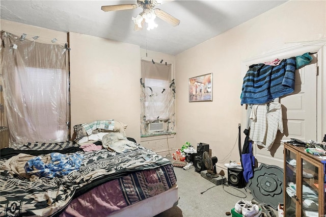 carpeted bedroom featuring cooling unit and ceiling fan