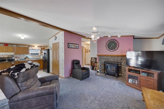 living room with ornamental molding, light colored carpet, and ceiling fan