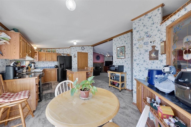 dining room with ornamental molding and light carpet