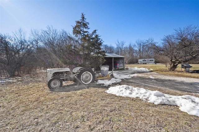 view of yard featuring a carport