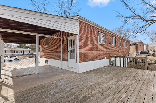 wooden terrace with an attached carport