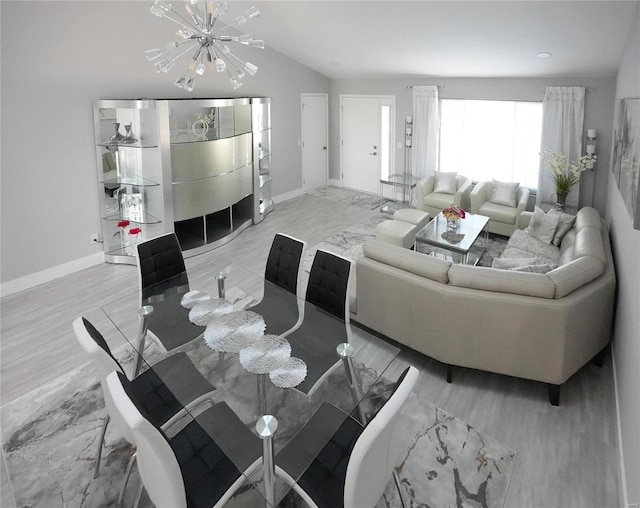 living room featuring a notable chandelier and vaulted ceiling