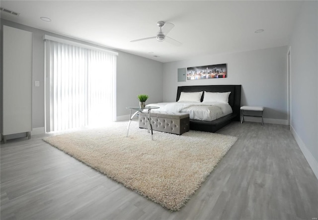 bedroom featuring wood-type flooring and ceiling fan