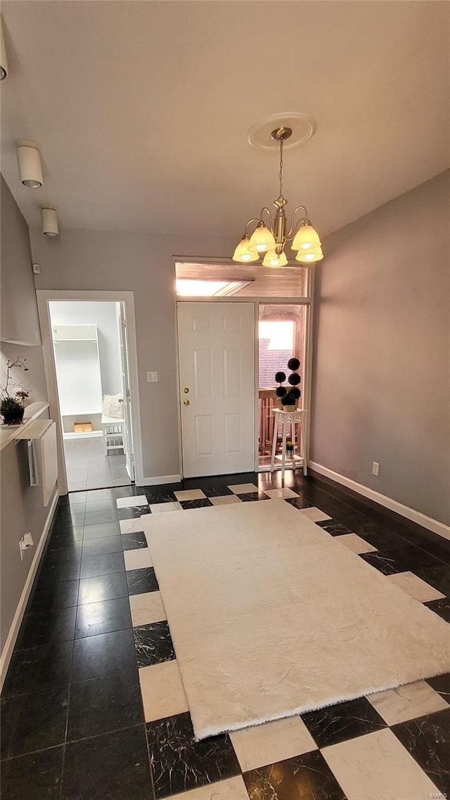 entryway featuring a notable chandelier