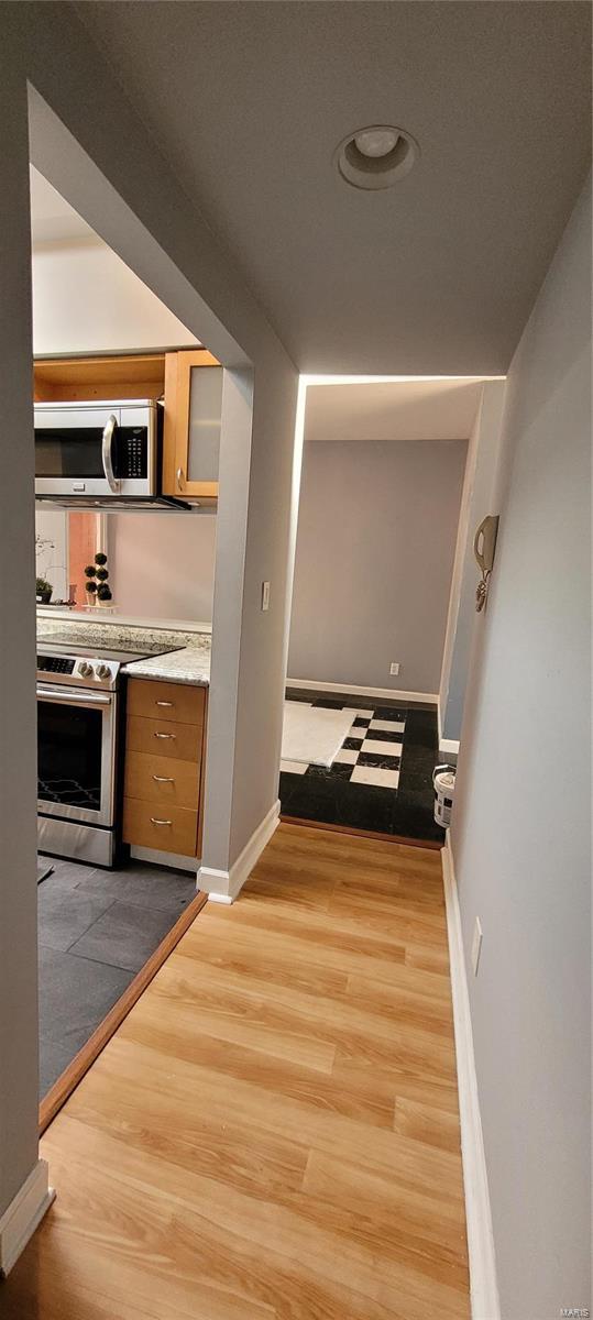 corridor featuring light hardwood / wood-style flooring