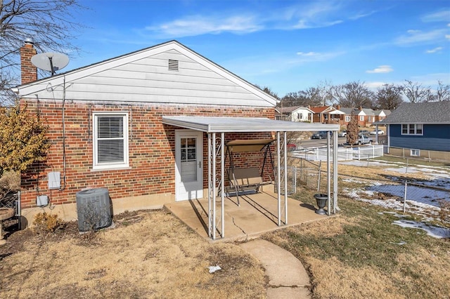 back of property with central air condition unit