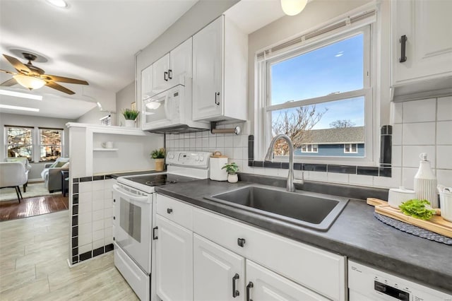 kitchen with ceiling fan, sink, white cabinets, and white appliances