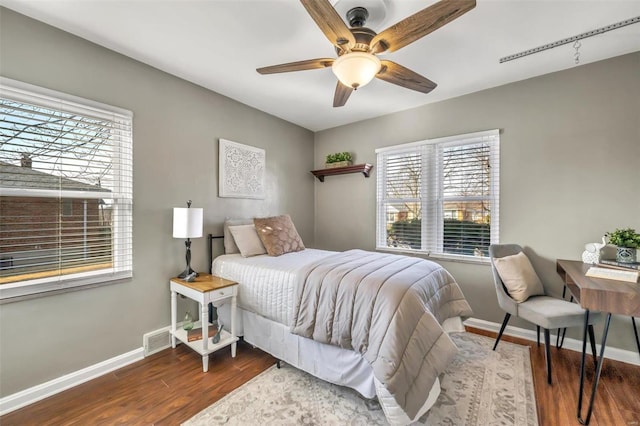 bedroom featuring dark hardwood / wood-style floors and ceiling fan