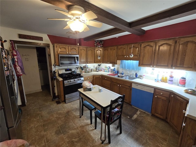 kitchen with ceiling fan, stainless steel appliances, beam ceiling, and sink