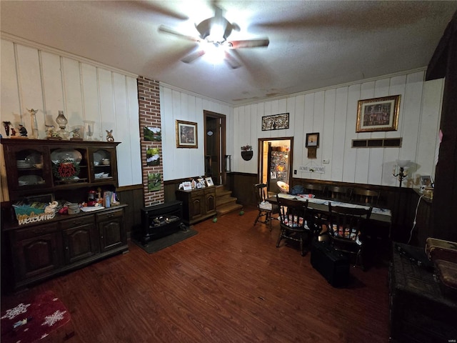 dining room with ceiling fan and dark hardwood / wood-style flooring