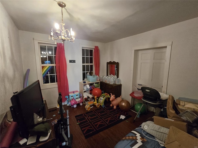 interior space featuring dark hardwood / wood-style flooring and a notable chandelier