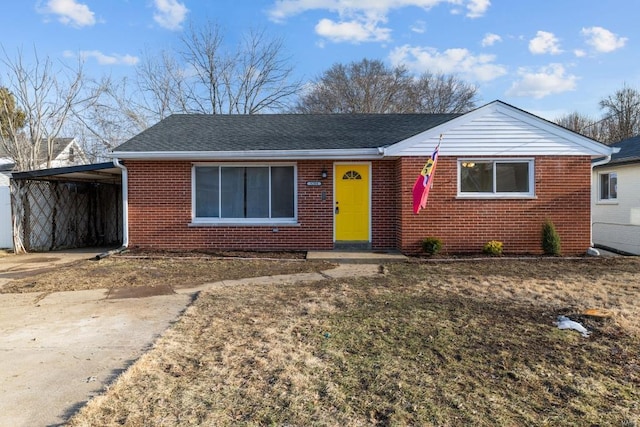 view of front of property featuring a carport