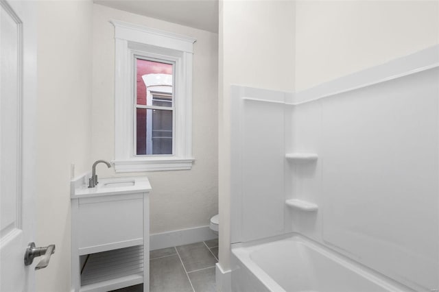 bathroom with vanity, tile patterned floors, and toilet