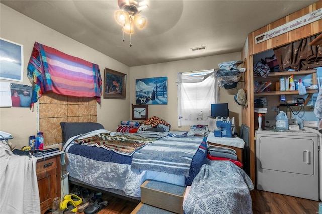 bedroom with wood-type flooring, washer / dryer, and ceiling fan