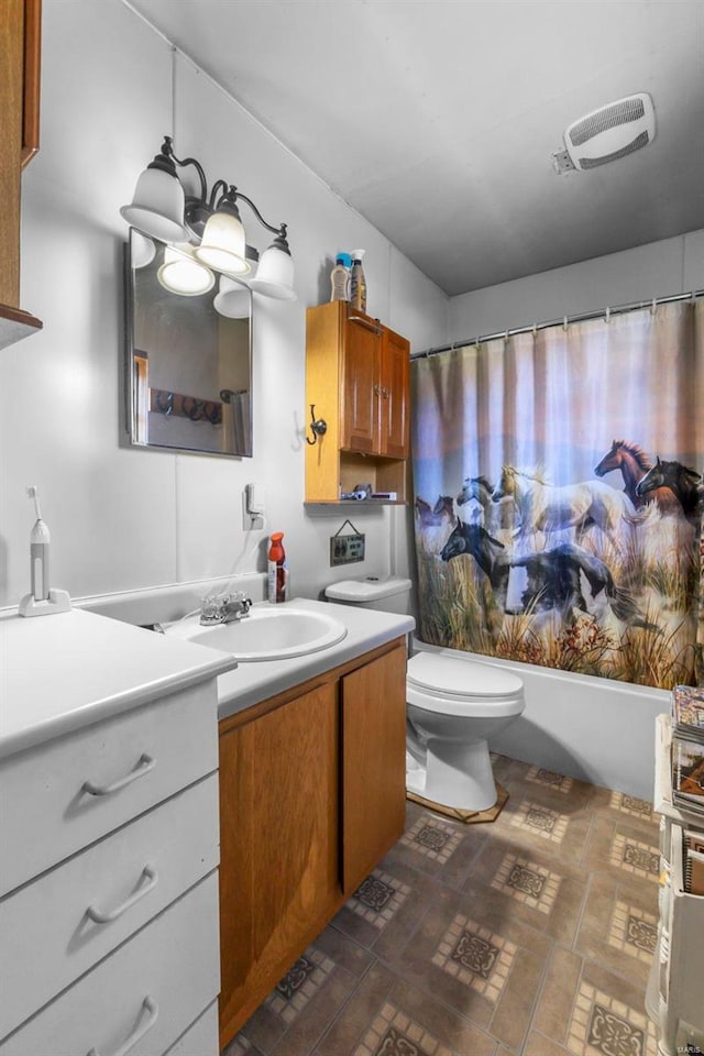 full bathroom featuring shower / bathtub combination with curtain, vanity, and toilet