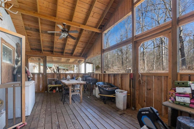 sunroom featuring vaulted ceiling with beams, wooden ceiling, and ceiling fan