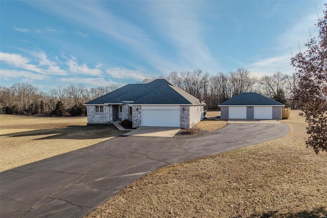 ranch-style home with a garage and a front lawn